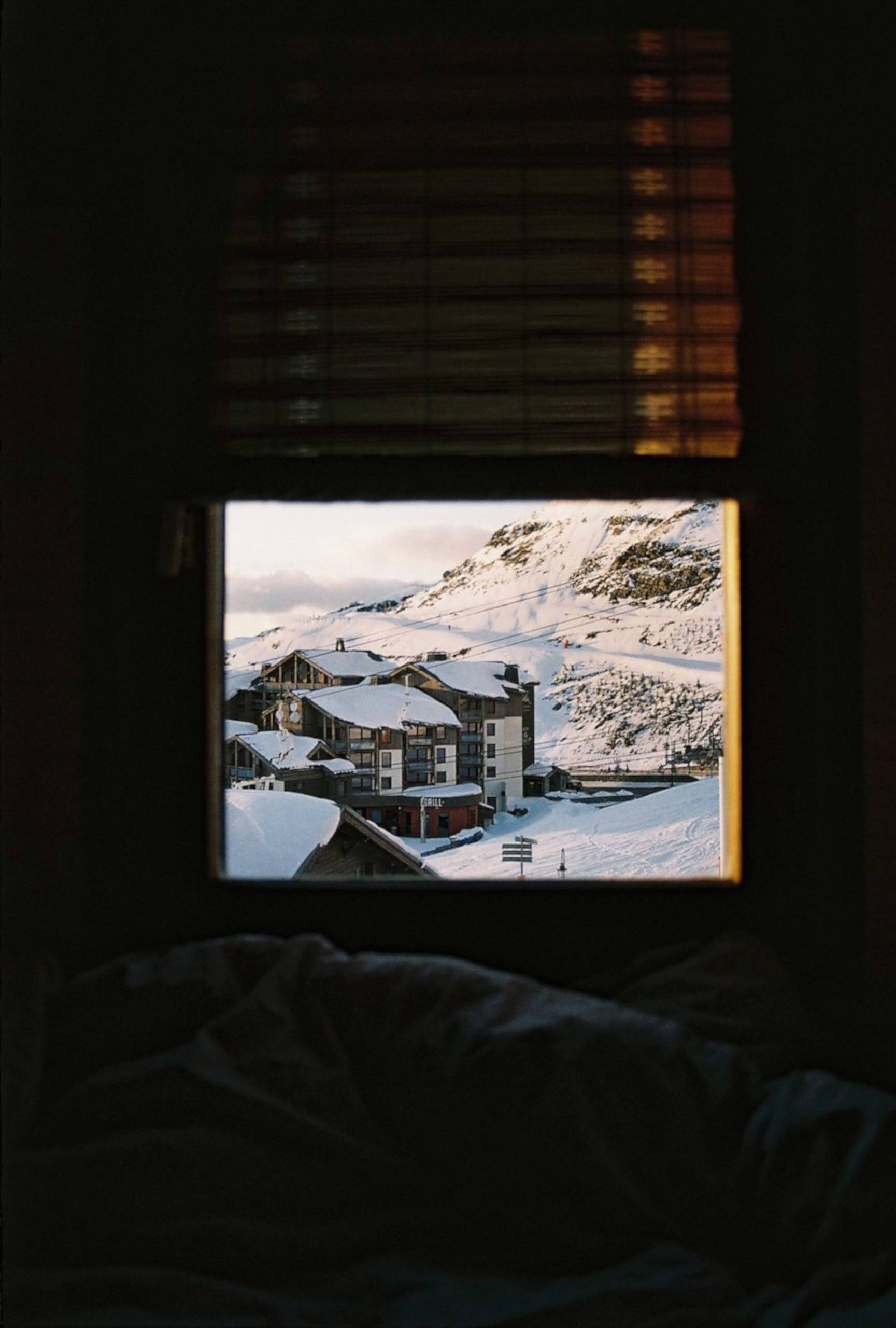 photo of building in the mountains covered with snow